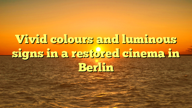 Vivid colours and luminous signs in a restored cinema in Berlin
